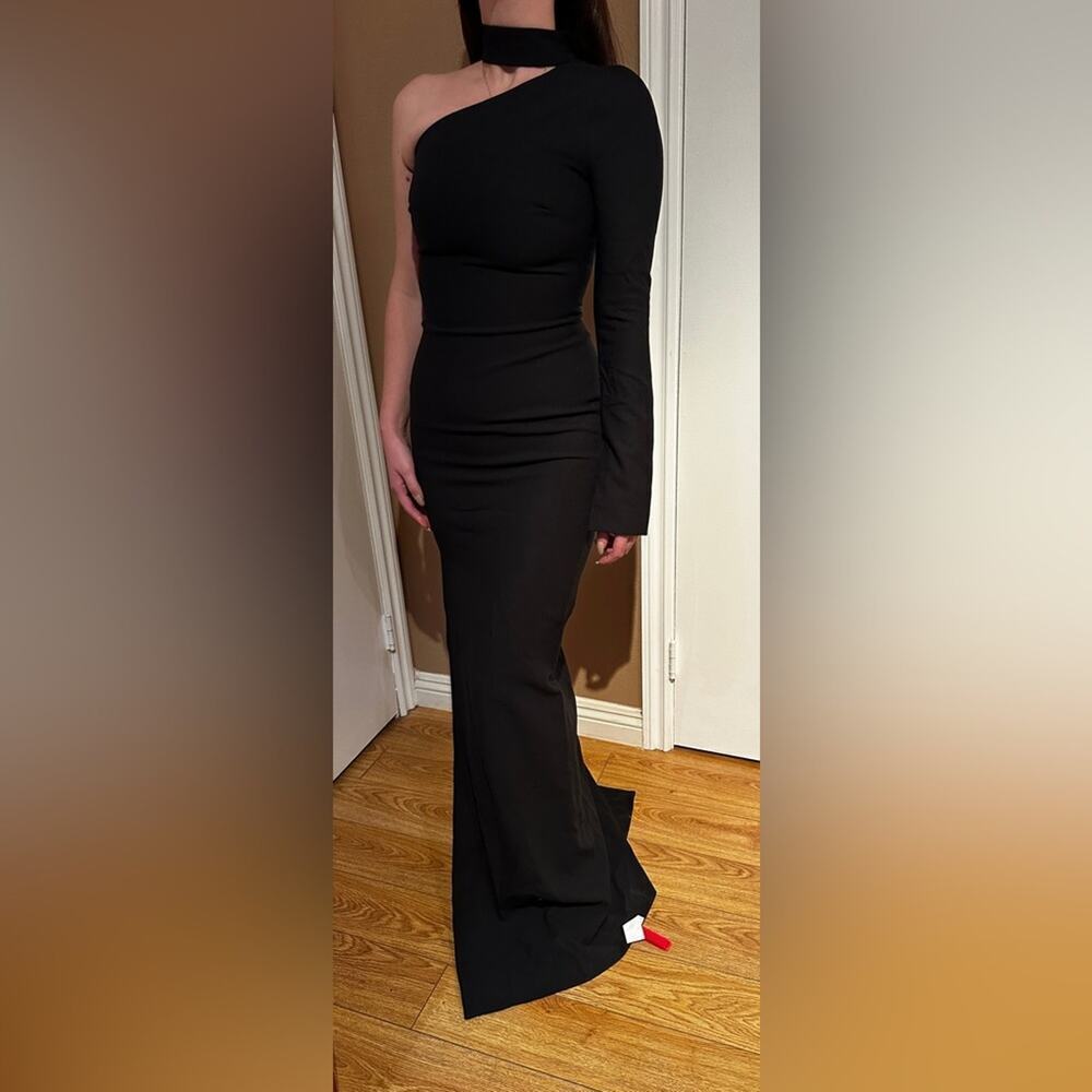 Cinq a Sept long black dress with neck strap. One shoulder with slit